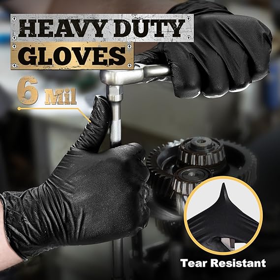 Heavy-duty gloves being used to handle mechanical parts with a focus on tear resistance.
