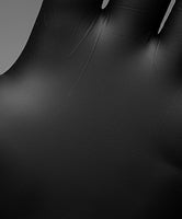 Close-up of a black surface with a small white object on it